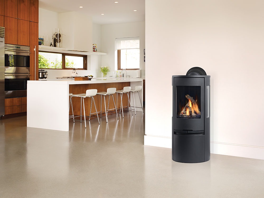 Black freestanding Regency Contura gas stove in a bright open-plan kitchen and living area